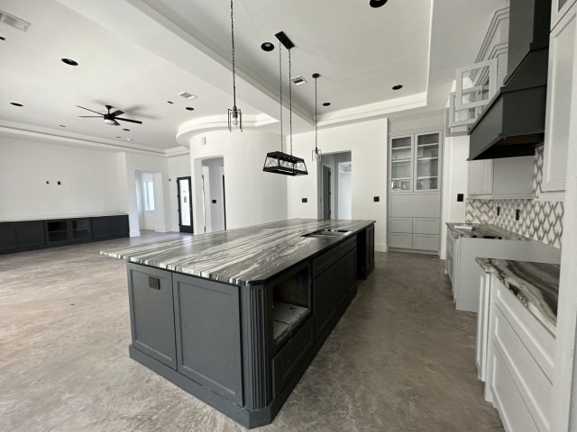 875 Lonestar Road Huntsville, TX 77340 - Photo 10 of 24 a kitchen with stainless steel appliances granite countertop a stove and a sink