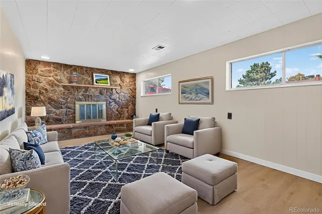 a living room with furniture and a rug