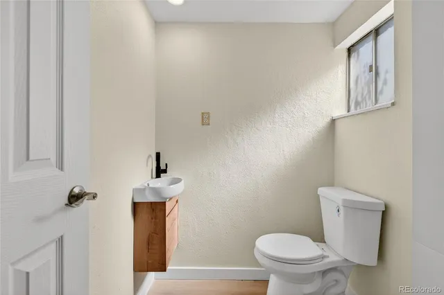 a bathroom with a toilet and a sink