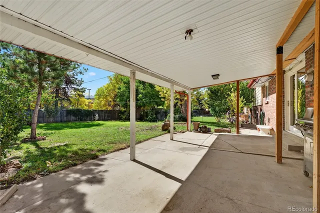 a view of a patio with a backyard