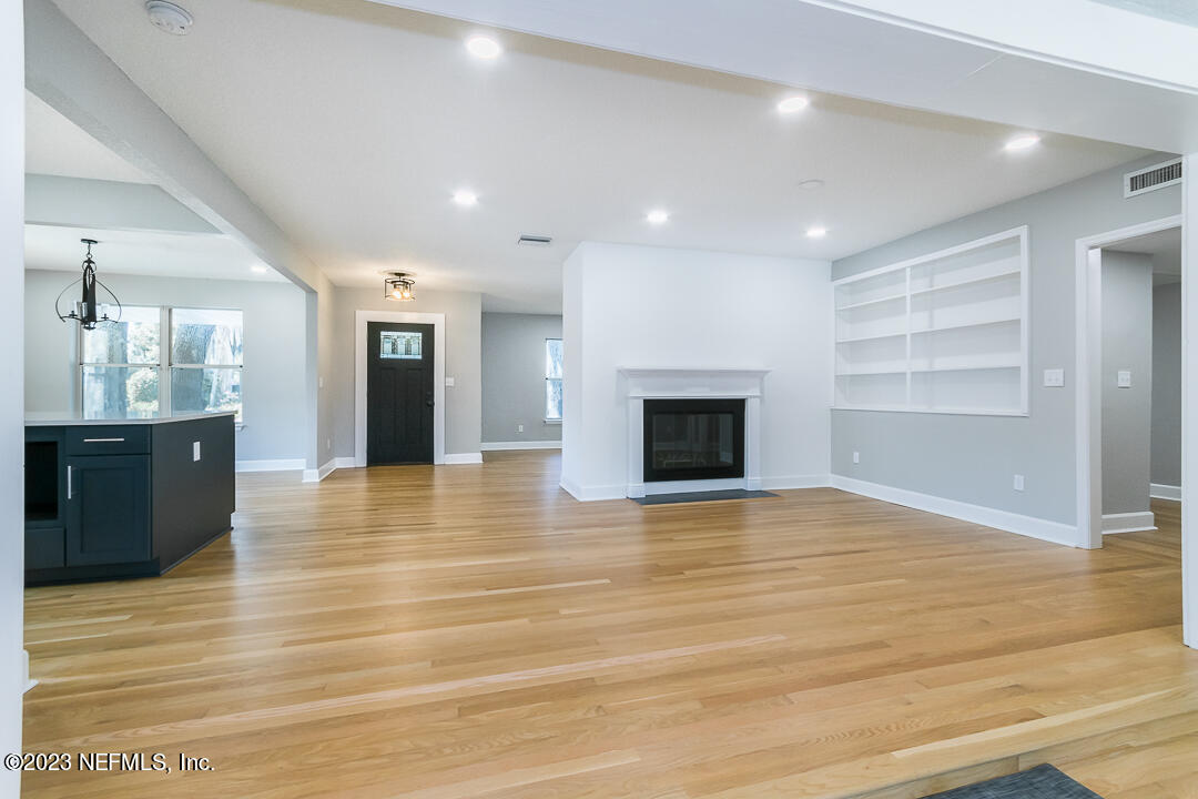 905 Waterman Road South Jacksonville, FL 32207 - Photo 11 of 19 a view of kitchen and empty room with wooden floor