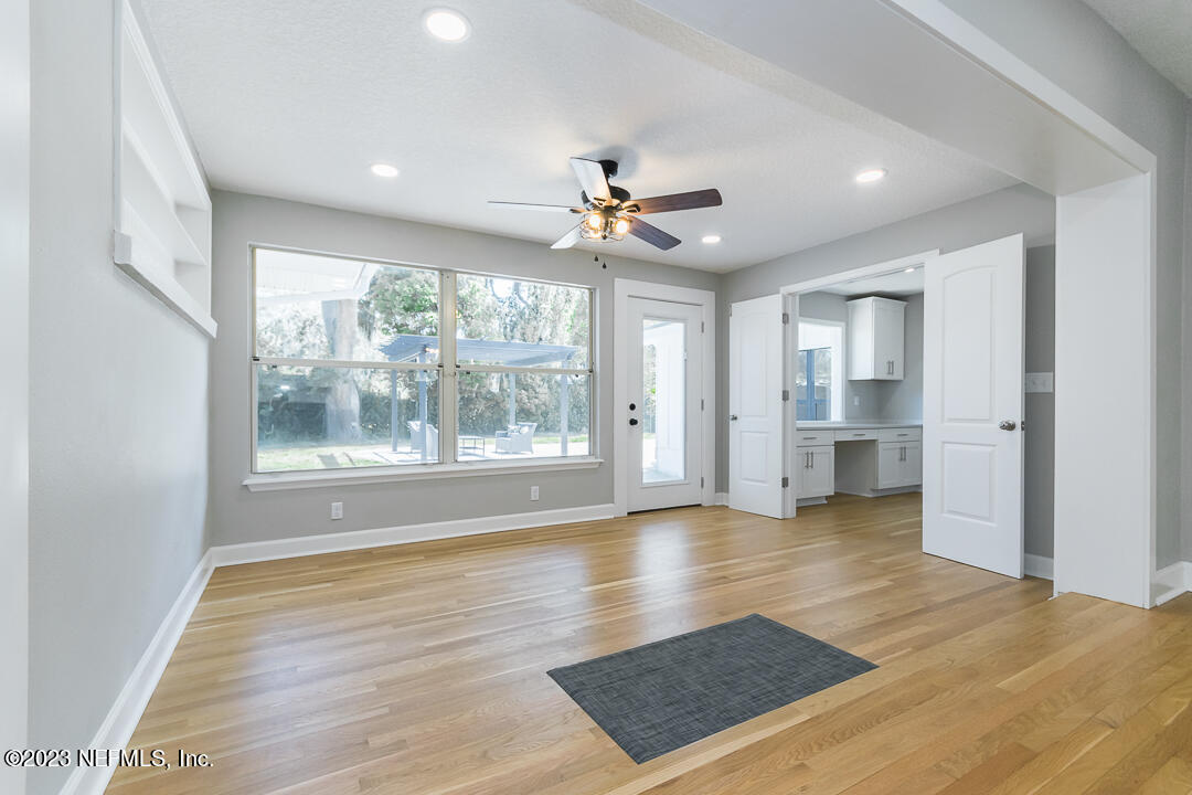 905 Waterman Road South Jacksonville, FL 32207 - Photo 12 of 19 a view of an empty room with a window and wooden floor