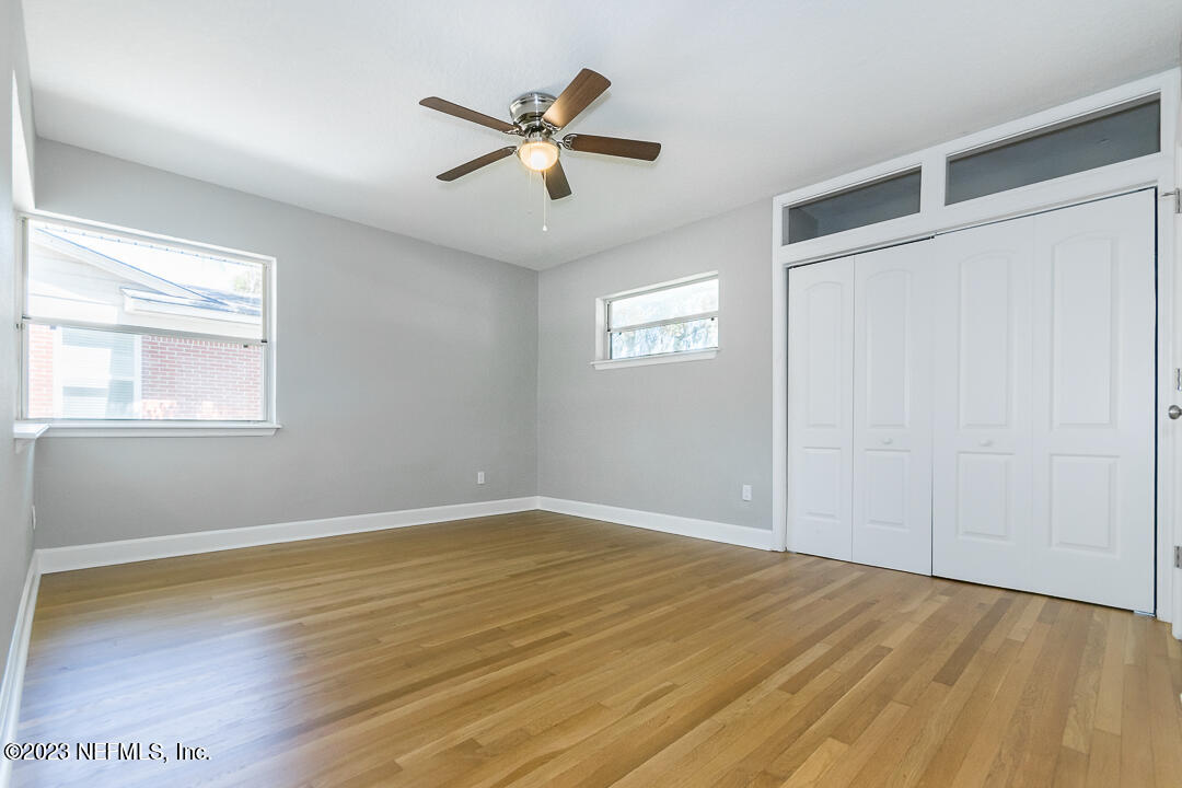 905 Waterman Road South Jacksonville, FL 32207 - Photo 16 of 19 a view of empty room with wooden floor and fan
