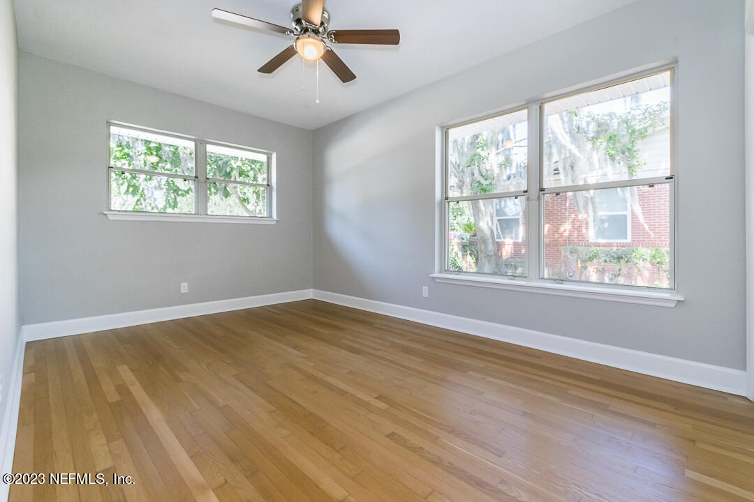 905 Waterman Road South Jacksonville, FL 32207 - Photo 18 of 19 a view of empty room with wooden floor and fan