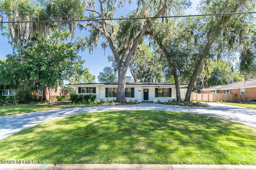 905 Waterman Road South Jacksonville, FL 32207 - Photo 2 of 19 a view of a house with a yard and tree s