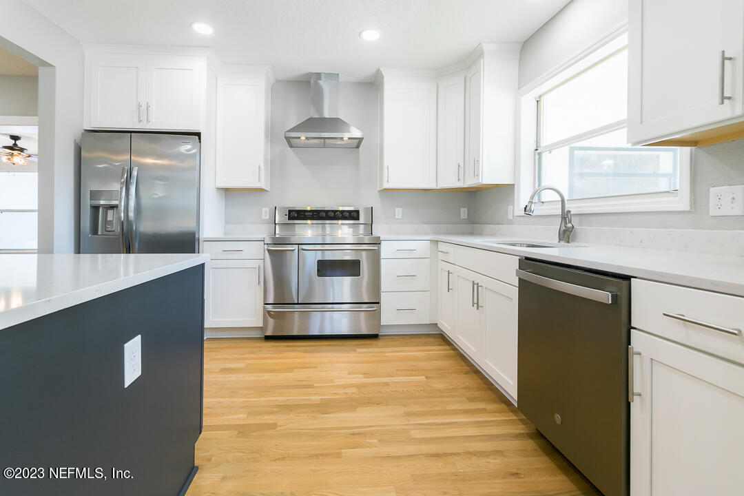 905 Waterman Road South Jacksonville, FL 32207 - Photo 4 of 19 a large kitchen with stainless steel appliances granite countertop a stove a sink and a refrigerator