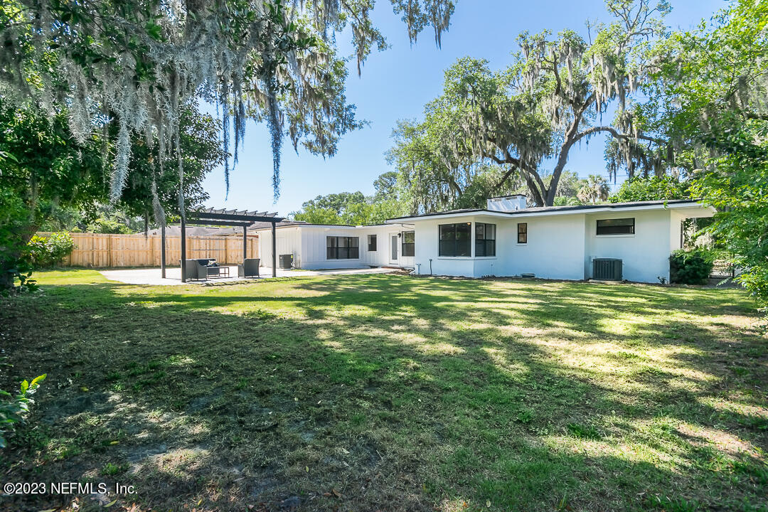 905 Waterman Road South Jacksonville, FL 32207 - Photo 7 of 19 a view of a house with a backyard