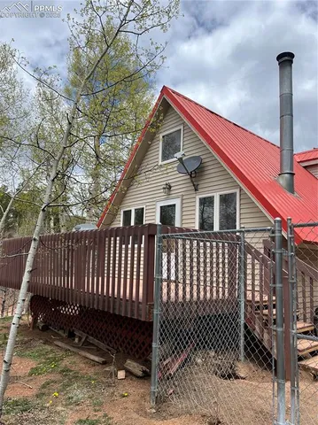 a front view of a house with a fence