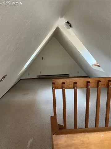 a kitchen with granite countertop a refrigerator and a stove