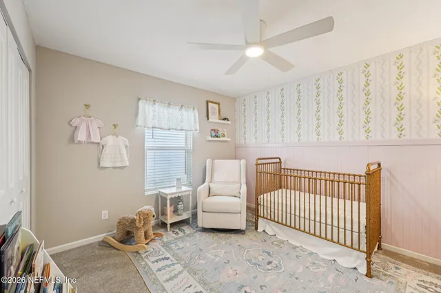 a bedroom with furniture and a window