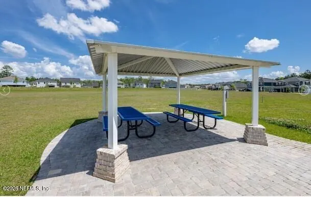 an outdoor space with furniture and umbrella