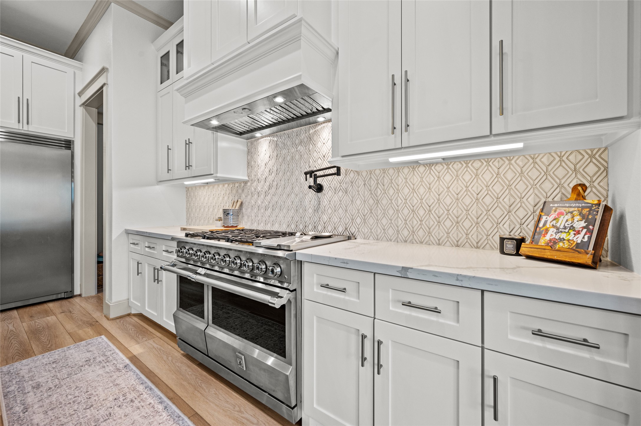 14923 Old Irish Farm Road Baytown, TX 77523 - Photo 11 of 50 Hestan 8 Inch Freestanding Gas Range with 5 Sealed Burners, Double Ovens, 7.4 Total Capacity, 12 Inch Griddle, Continuous Cast Iron Grates, CircuFlame™ Power Burner, PureVection™ Technology, and Infrared Broiler: Steeletto, Liquid Propane