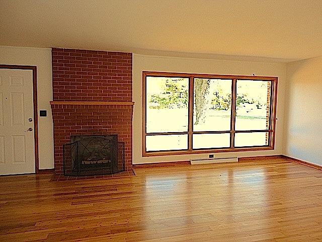 106 Doak Road Manchester, TN 37355 - Photo 3 of 19 The living room with new beautiful bamboo floors and a nice fireplace to keep the room cozy this winter. The beautiful large windows add such an elegant touch to the room. 14x23