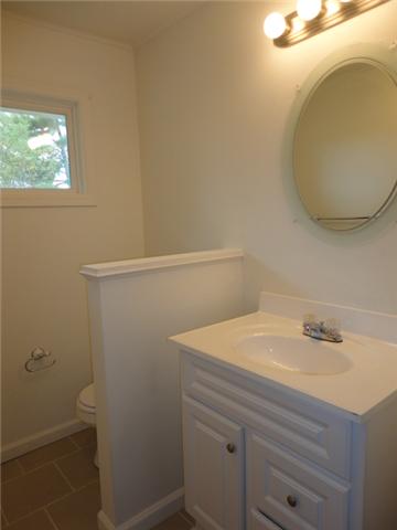 106 Doak Road Manchester, TN 37355 - Photo 6 of 19 The hall bath with new tile flooring and vanity.