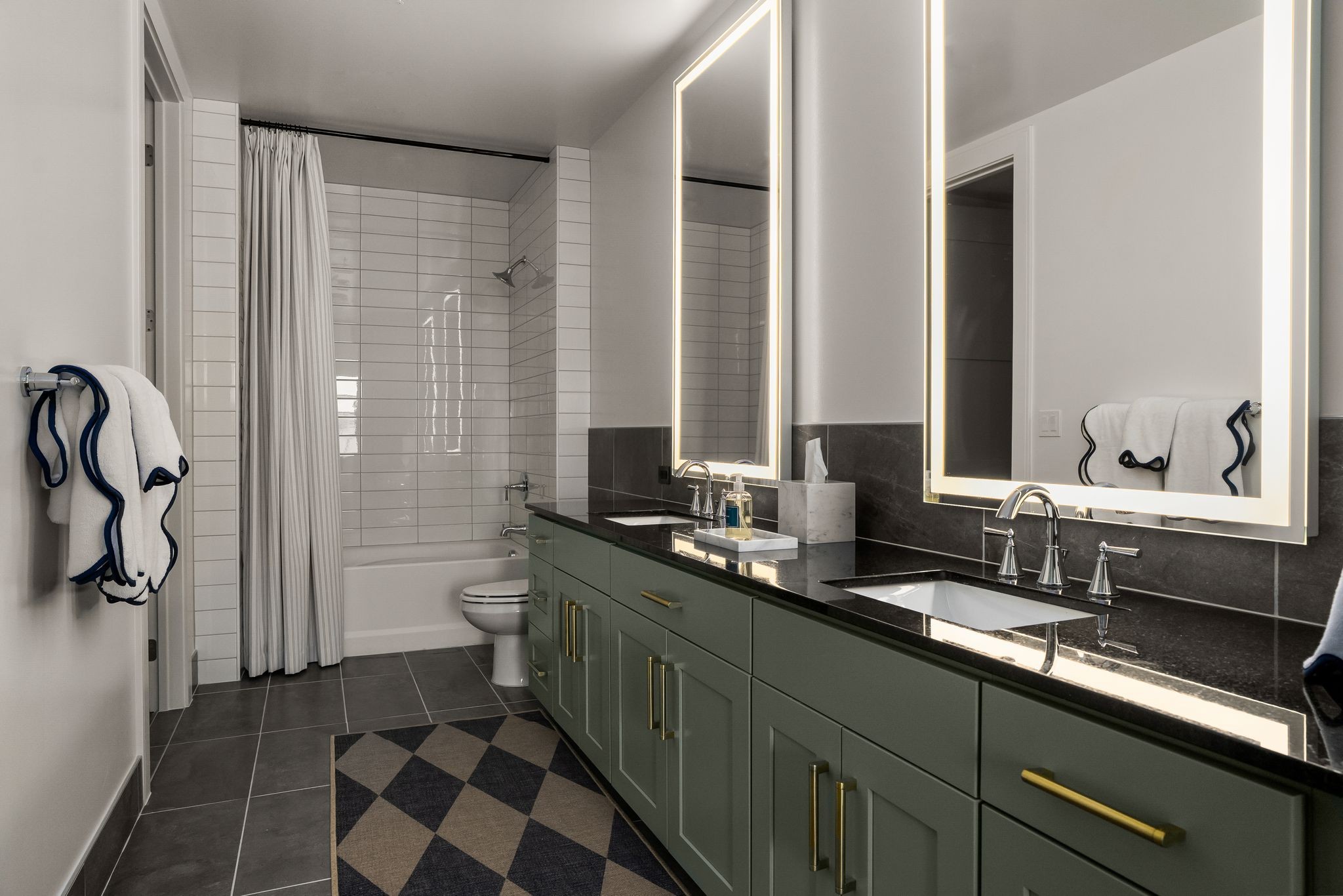 930 Commerce Street, Unit 30 Nashville, TN 37203 - Photo 15 of 45 a bathroom with a double vanity sink and a mirror