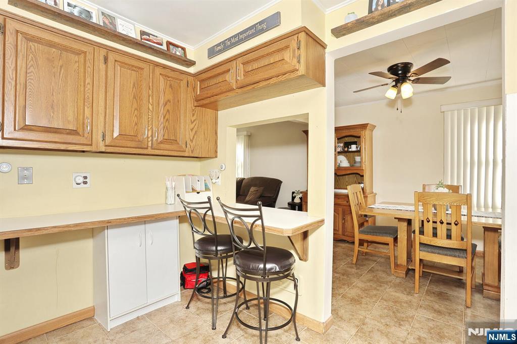 40 Depew Street Dumont, NJ 07628 - Photo 11 of 38 a workspace with wooden floor and a chandelier