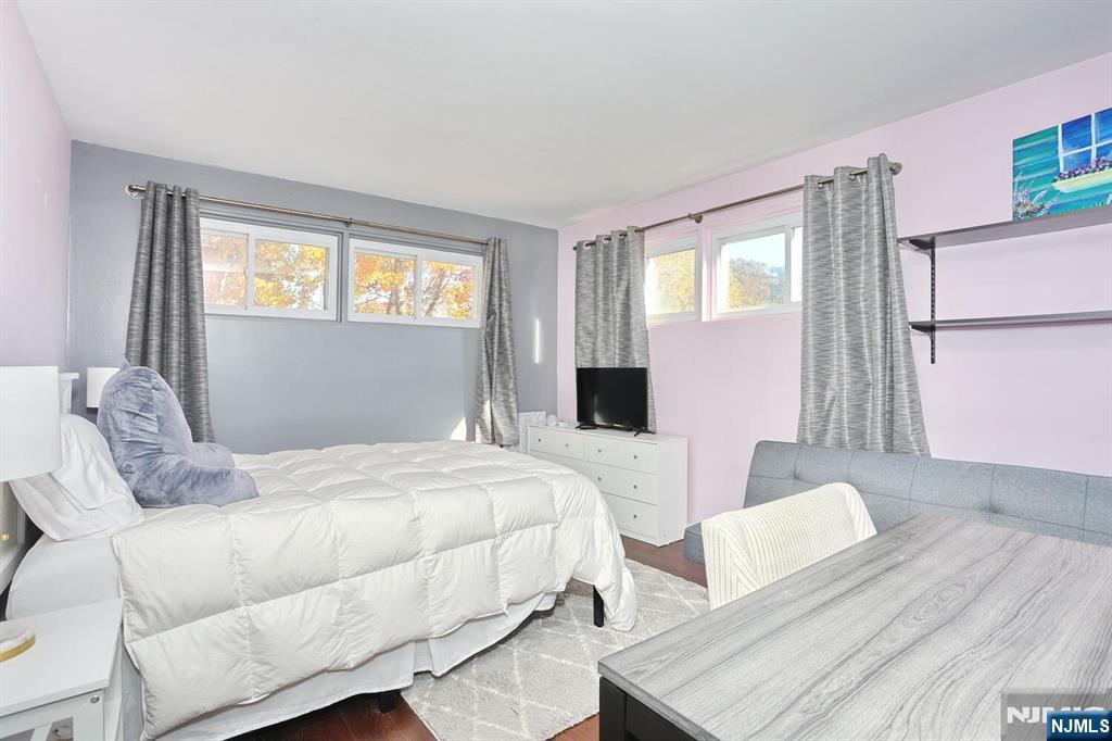 40 Depew Street Dumont, NJ 07628 - Photo 14 of 38 a bedroom with a bed and wooden floor
