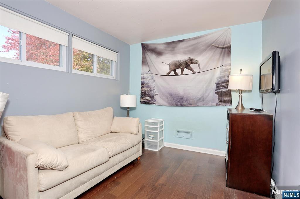 40 Depew Street Dumont, NJ 07628 - Photo 15 of 38 a living room with furniture and a flat screen tv