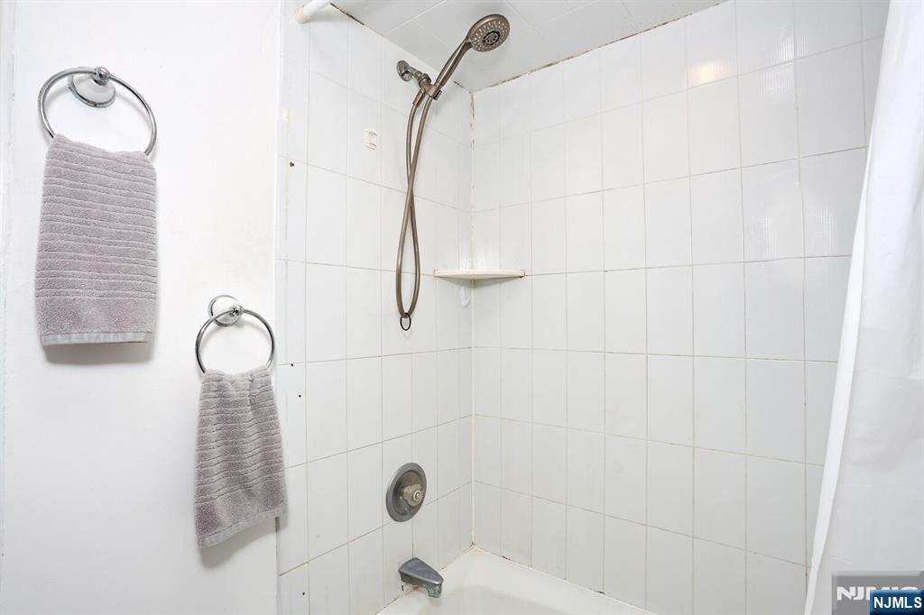 40 Depew Street Dumont, NJ 07628 - Photo 17 of 38 a bathroom with a shower