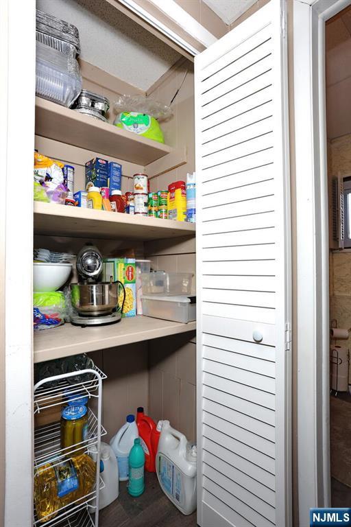 40 Depew Street Dumont, NJ 07628 - Photo 26 of 38 a utility room with lots of clutter and cabinets