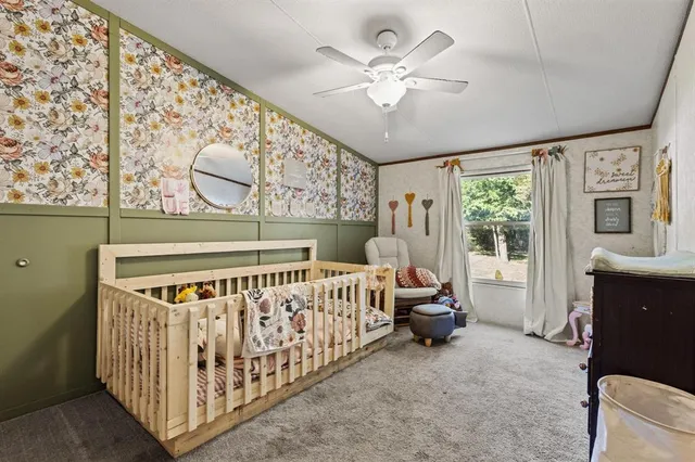 a bedroom with furniture and windows