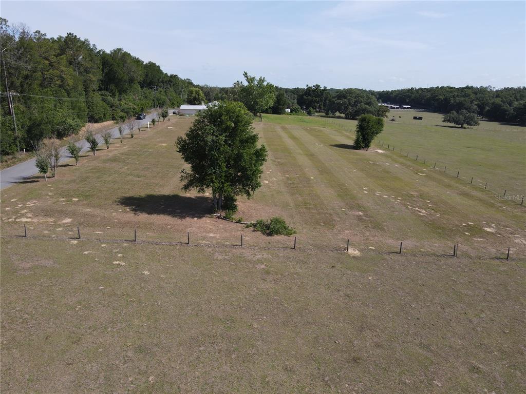 1 Smith Road Dade City, FL 33525 - Photo 16 of 25 a view of a lake with trees in the background