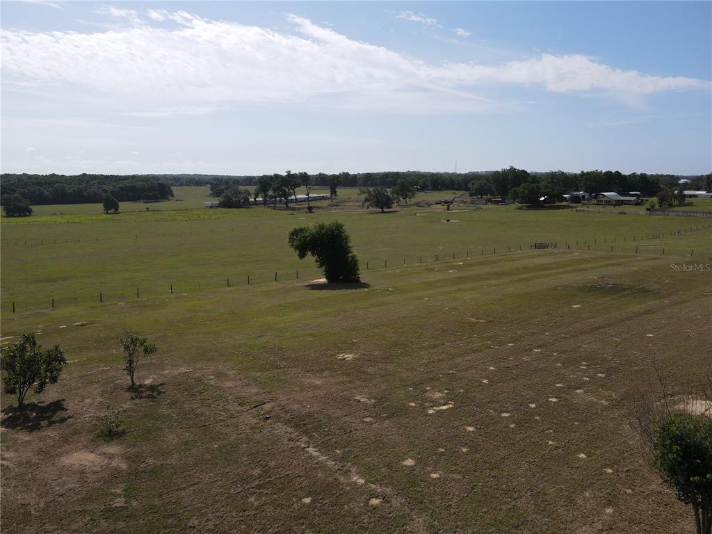 1 Smith Road Dade City, FL 33525 - Photo 21 of 25 a view of a lake with houses in back