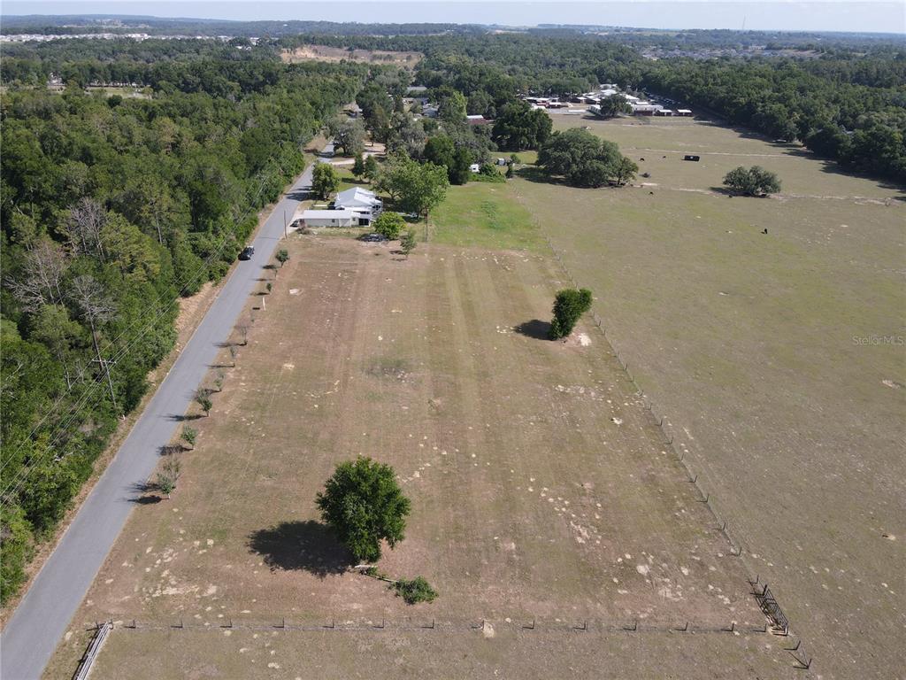 1 Smith Road Dade City, FL 33525 - Photo 7 of 25 an aerial view of a house with a yard and lake view