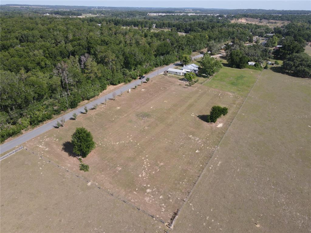 1 Smith Road Dade City, FL 33525 - Photo 8 of 25 a view of a street with a forest