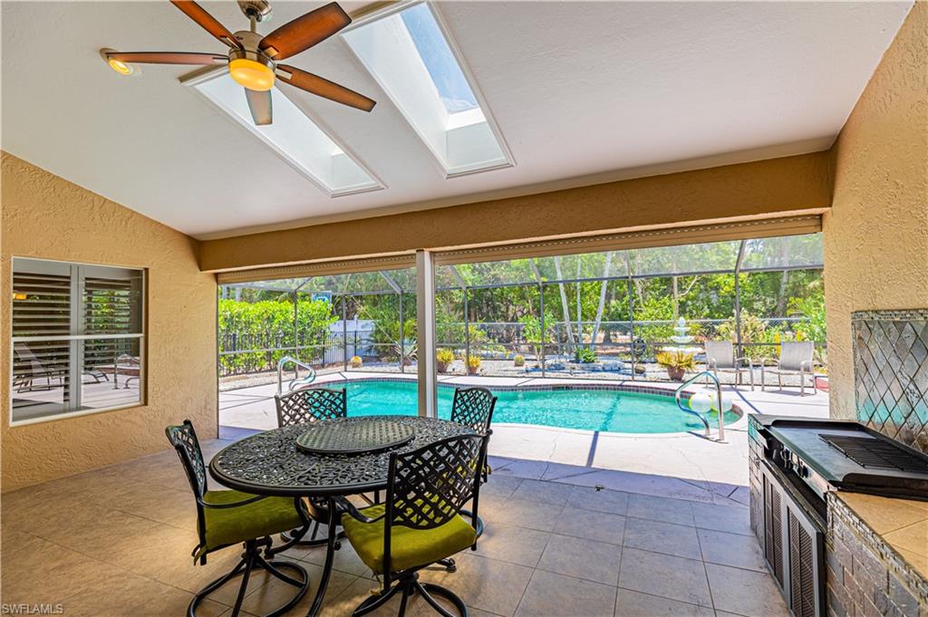 2100 Piccadilly Circus Naples, FL 34112 - Photo 3 of 30 a dining room with furniture and a floor to ceiling window