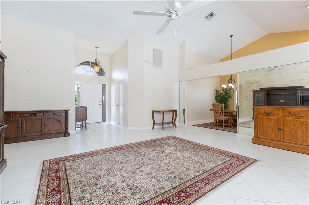 2100 Piccadilly Circus Naples, FL 34112 - Photo 5 of 30 a living room with furniture and wooden floor