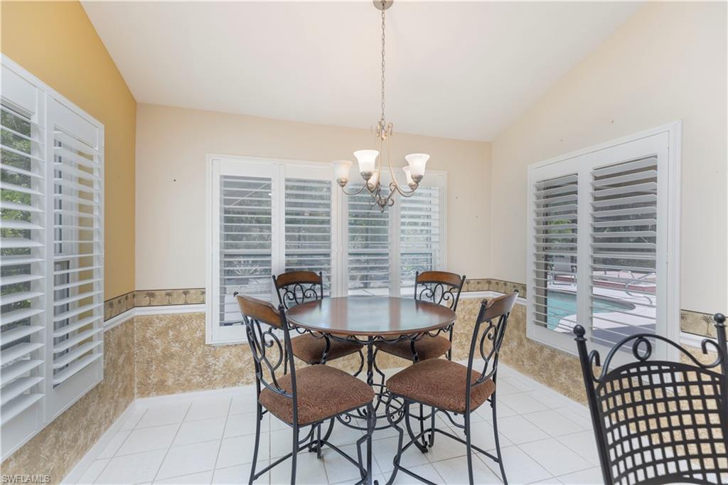 2100 Piccadilly Circus Naples, FL 34112 - Photo 10 of 30 a view of a dining room with furniture and windows