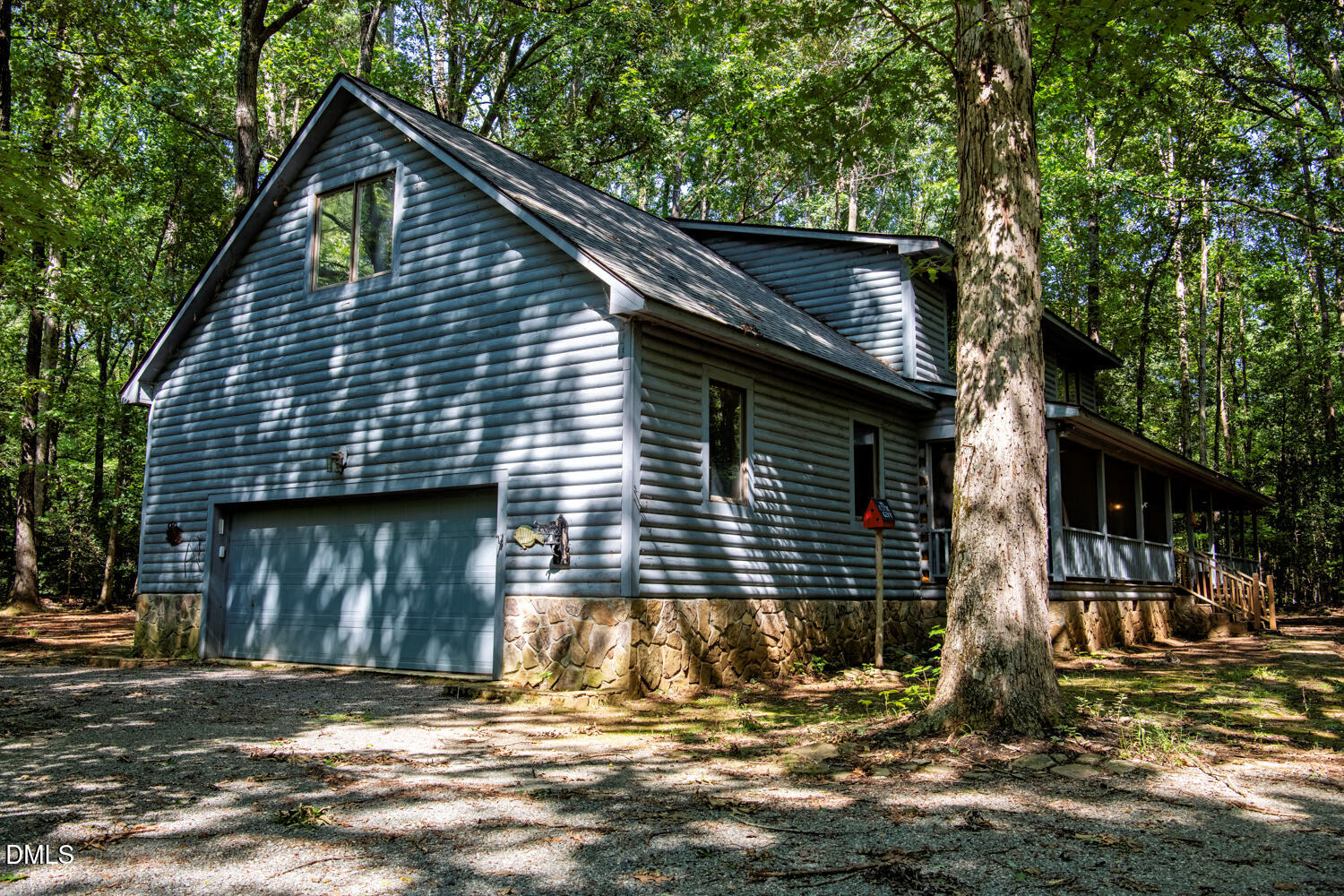 7391 Howerton Road Elon, NC 27244 - Photo 44 of 53 Siding exterior with stone foundation and attached garage