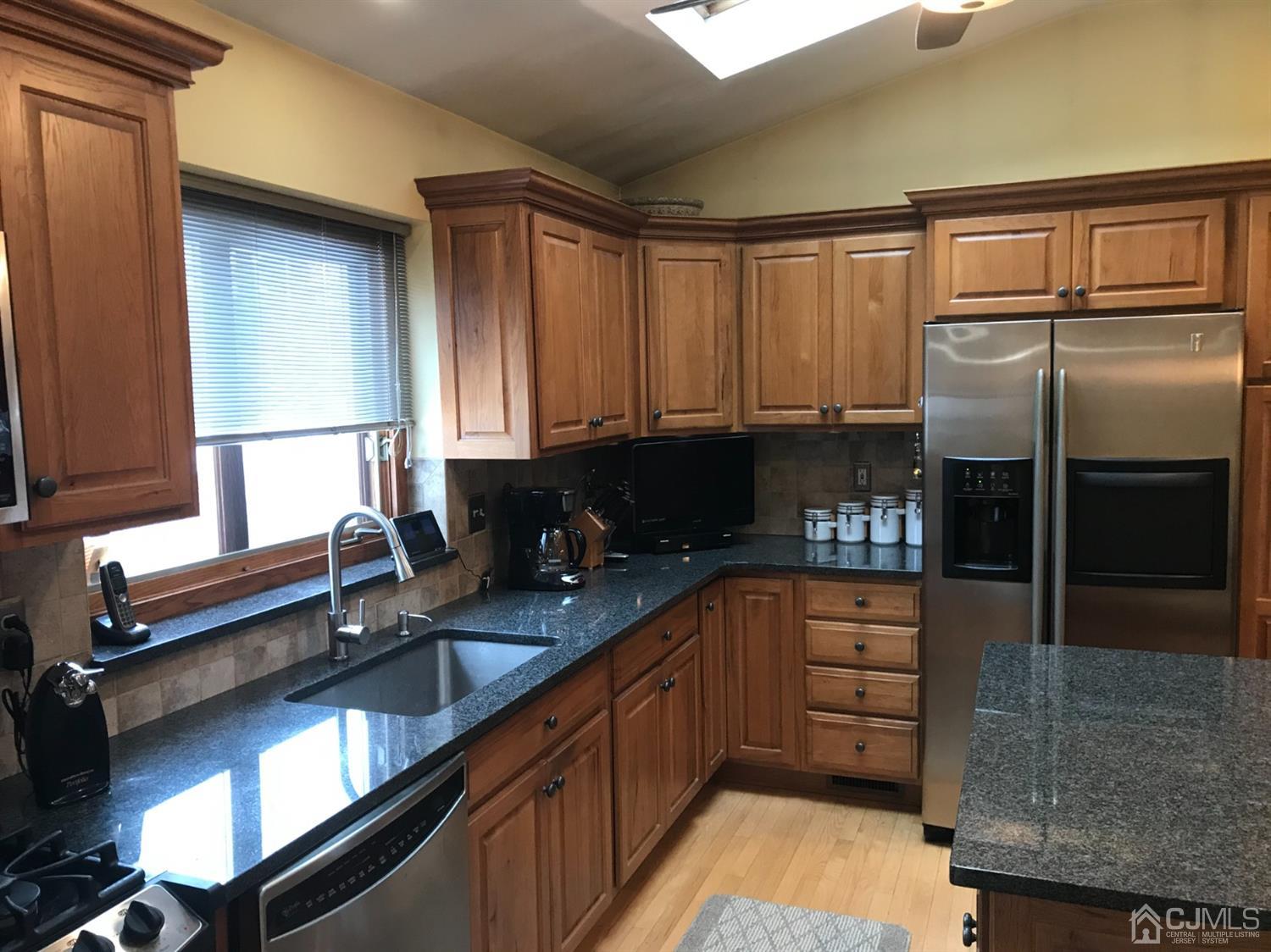 10 Wilcox Road New Brunswick, NJ 08901 - Photo 25 of 41 a kitchen with a refrigerator and a sink