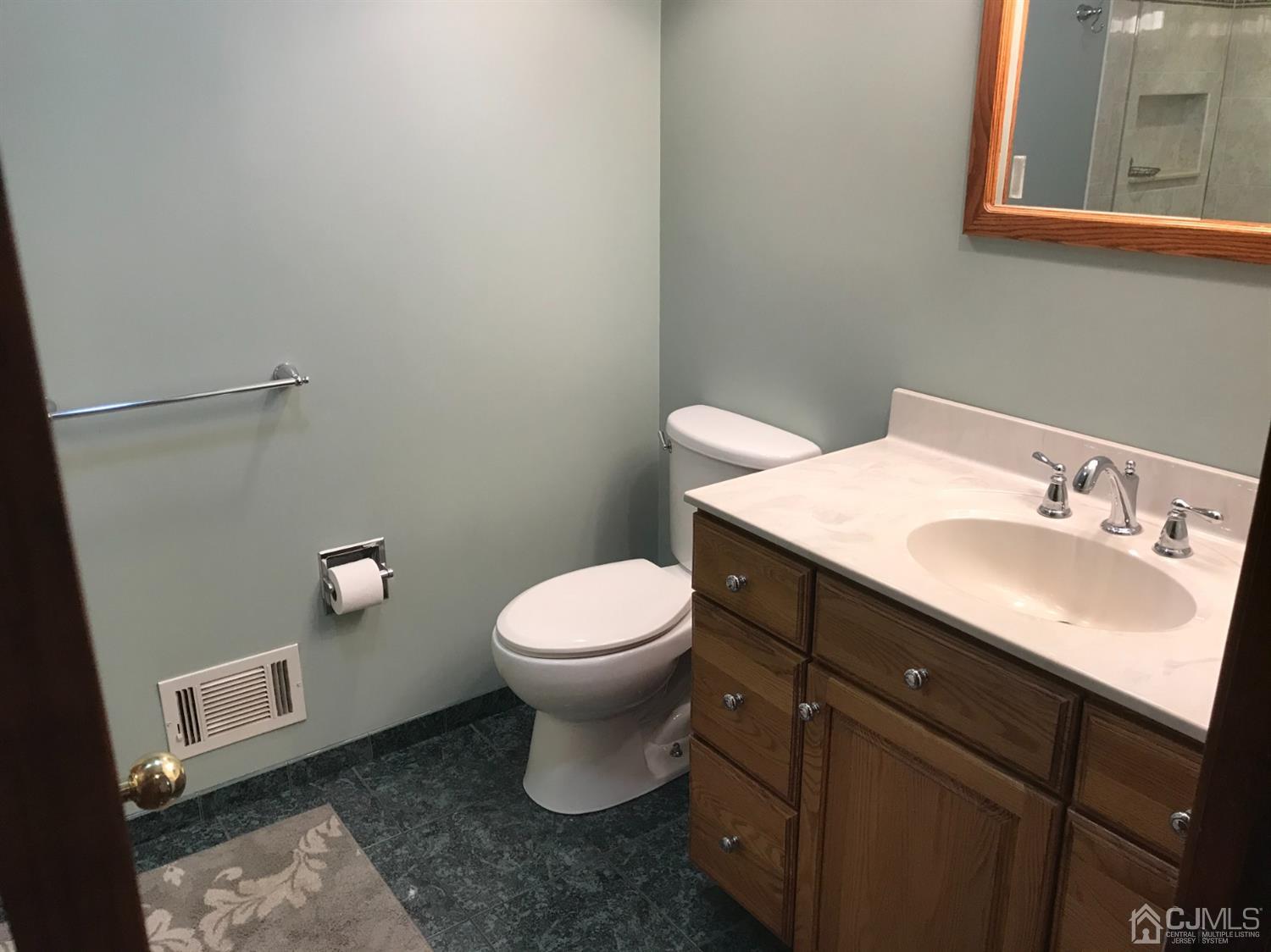 10 Wilcox Road New Brunswick, NJ 08901 - Photo 5 of 41 a bathroom with a sink and a toilet