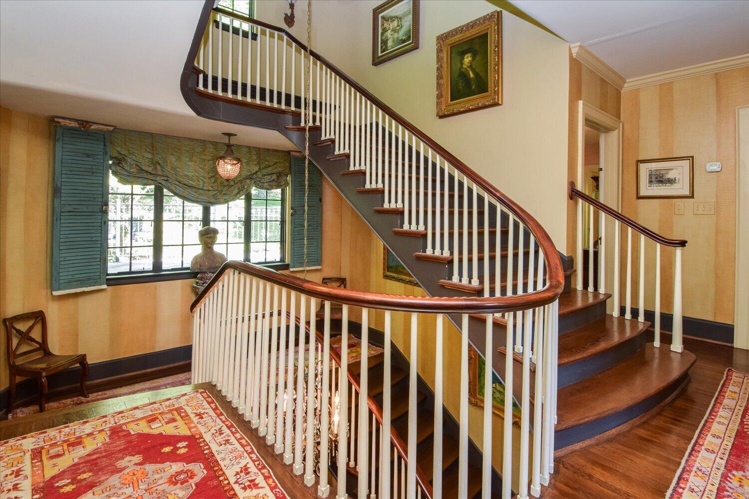 2412 Robin Hood Road Southeast Roanoke, VA 24014 - Photo 33 of 59 a view of staircase with lots of frames on wall and a window