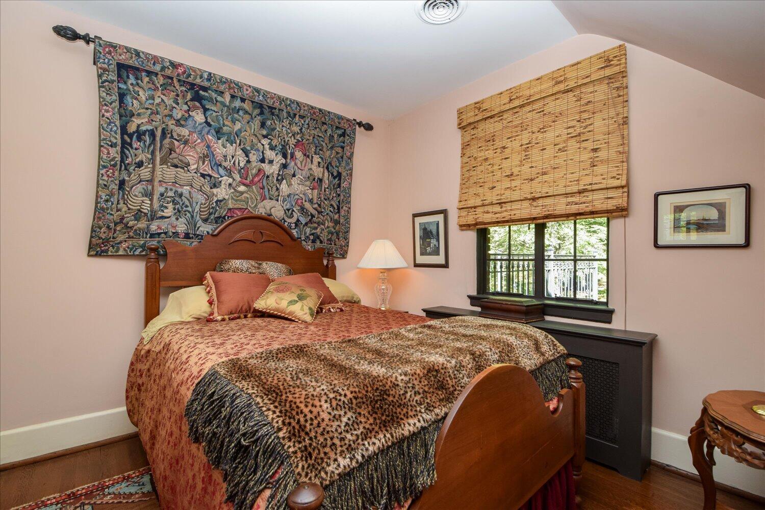 2412 Robin Hood Road Southeast Roanoke, VA 24014 - Photo 35 of 59 a bed sitting in a bedroom next to a window