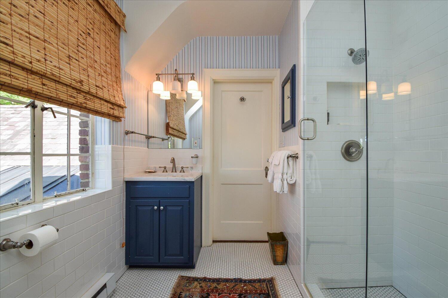 2412 Robin Hood Road Southeast Roanoke, VA 24014 - Photo 43 of 59 a bathroom with a sink a mirror and shower