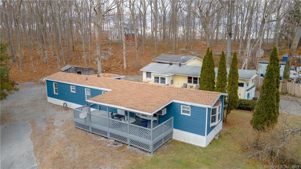 18 Naomi Drive Ledyard, CT 06339 - Photo 1 of 1 an aerial view of a house with a yard table and chairs