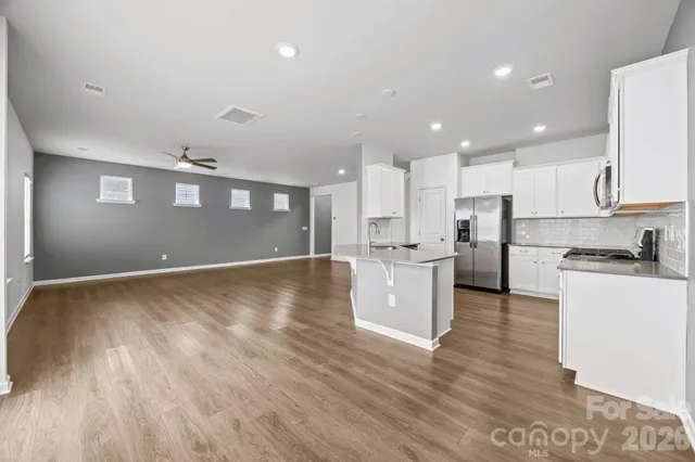 a view of kitchen with wooden floor