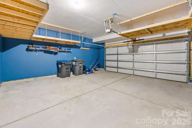 an aerial view of a house with a view of city
