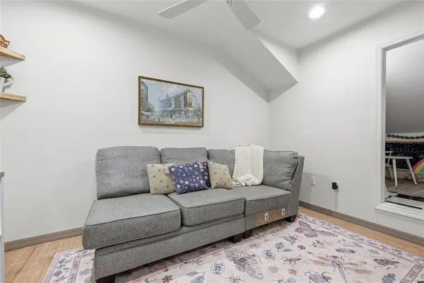 a living room with furniture and a rug