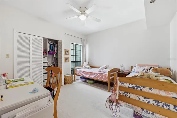 a bedroom with furniture and a chandelier