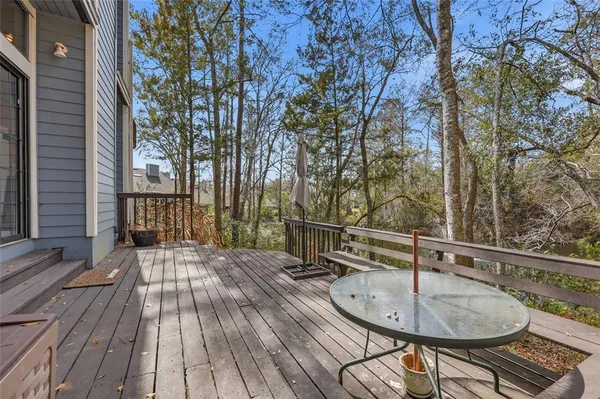 a backyard of a house with table and chairs
