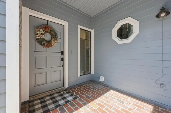 a view of a wooden door and a window