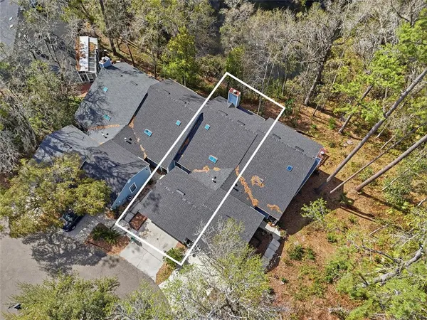 an aerial view of house with yard