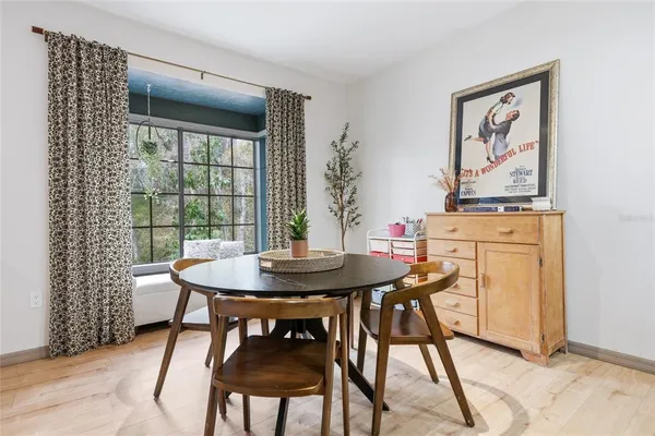 a view of a dining room with furniture and window