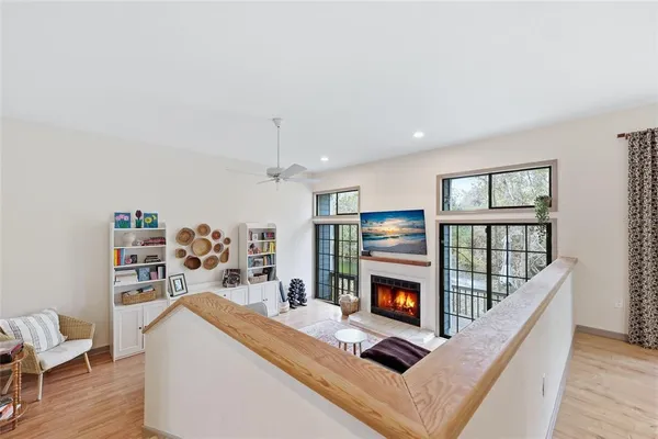 a living room with furniture fireplace and flat screen tv