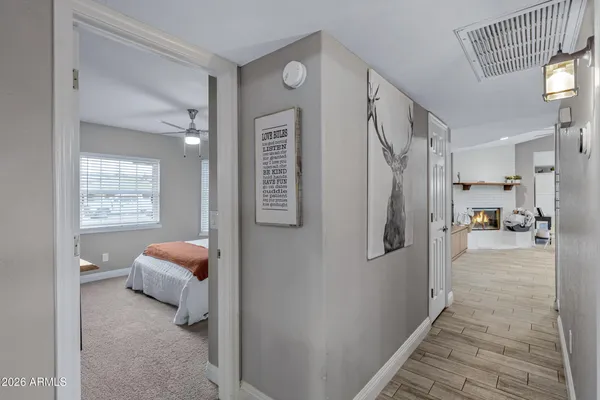 a view of a bedroom with bed and hallway