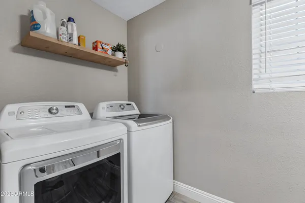 a utility room with dryer and washer